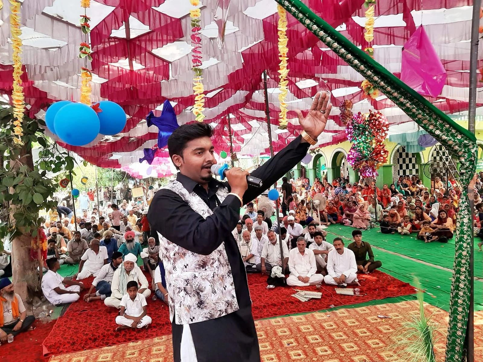 Sidhu Badshah live performance at outdoor religious event